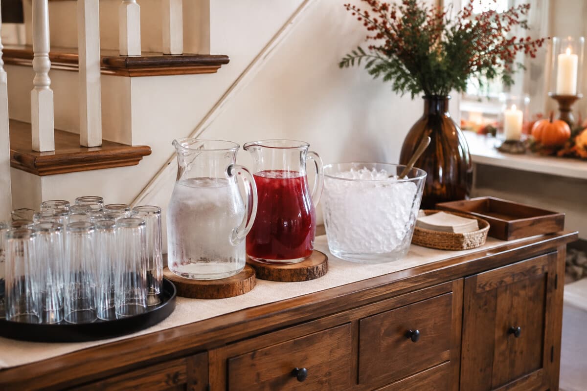 A self-serve drink station arranged for easy Thanksgiving guest traffic
